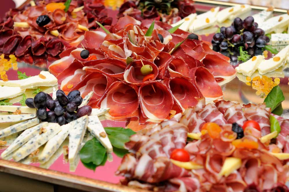 Trays of different meats and cheeses